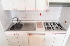 Fridge, stovetop, coffee/tea maker, cookware/dishes/utensils