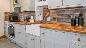 Fridge, electric kettle, toaster, cookware/dishes/utensils