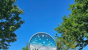 A sign for 'Sky Dome Glamping' with a dome structure in the background. - SKY DOME (Berinta)