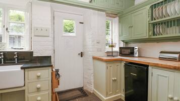 Fridge, electric kettle, toaster, cookware/dishes/utensils