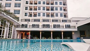 A hotel with a large pool area featuring a mosaic tile design. - Le Erawan Hotel (Phang Nga)