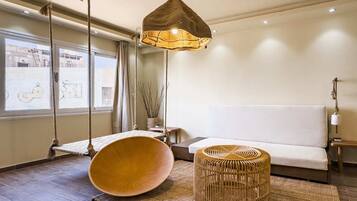 Apartamento básico | Área de estar | Smart TV 55 polegadas com canais via satélite