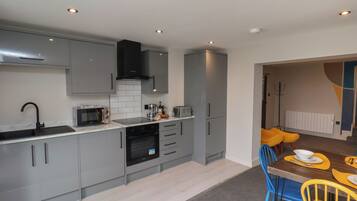 Fridge, electric kettle, toaster, cookware/dishes/utensils