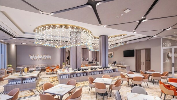 A modern hotel lobby with marble flooring, a central bar area, and contemporary seating arrangements. - Wahid Prime Hotel Salatiga (Salatiga)
