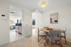 Enjoy meals in this stylish dining area with a round table and comfortable seating for four.