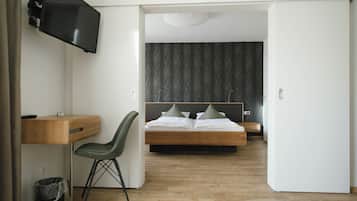 Suite, Garden View | In-room safe, desk, laptop workspace, blackout curtains