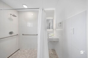 Shower, hair dryer, towels, shampoo