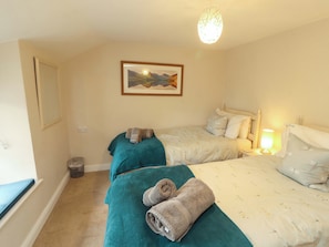 A hotel room with two beds, a painting on the wall, and a lamp on the nightstand. - Byways (Ambleside)