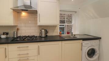 Fridge, electric kettle, toaster, cookware/dishes/utensils