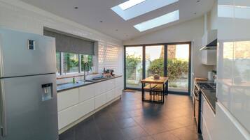 Fridge, dishwasher, electric kettle, cookware/dishes/utensils