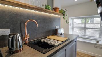Fridge, electric kettle, toaster, cookware/dishes/utensils