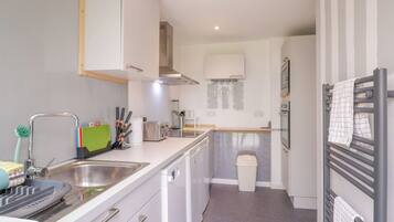 Fridge, dishwasher, electric kettle, cookware/dishes/utensils