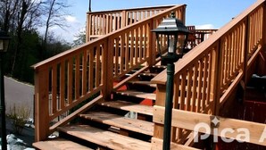 A wooden staircase with a metal railing and a street lamp. - Agriturismo Prisma: Single Room with Private Bathroom (Villa Vergano)