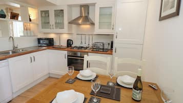 Fridge, electric kettle, toaster, cookware/dishes/utensils