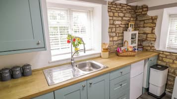 Fridge, electric kettle, toaster, cookware/dishes/utensils
