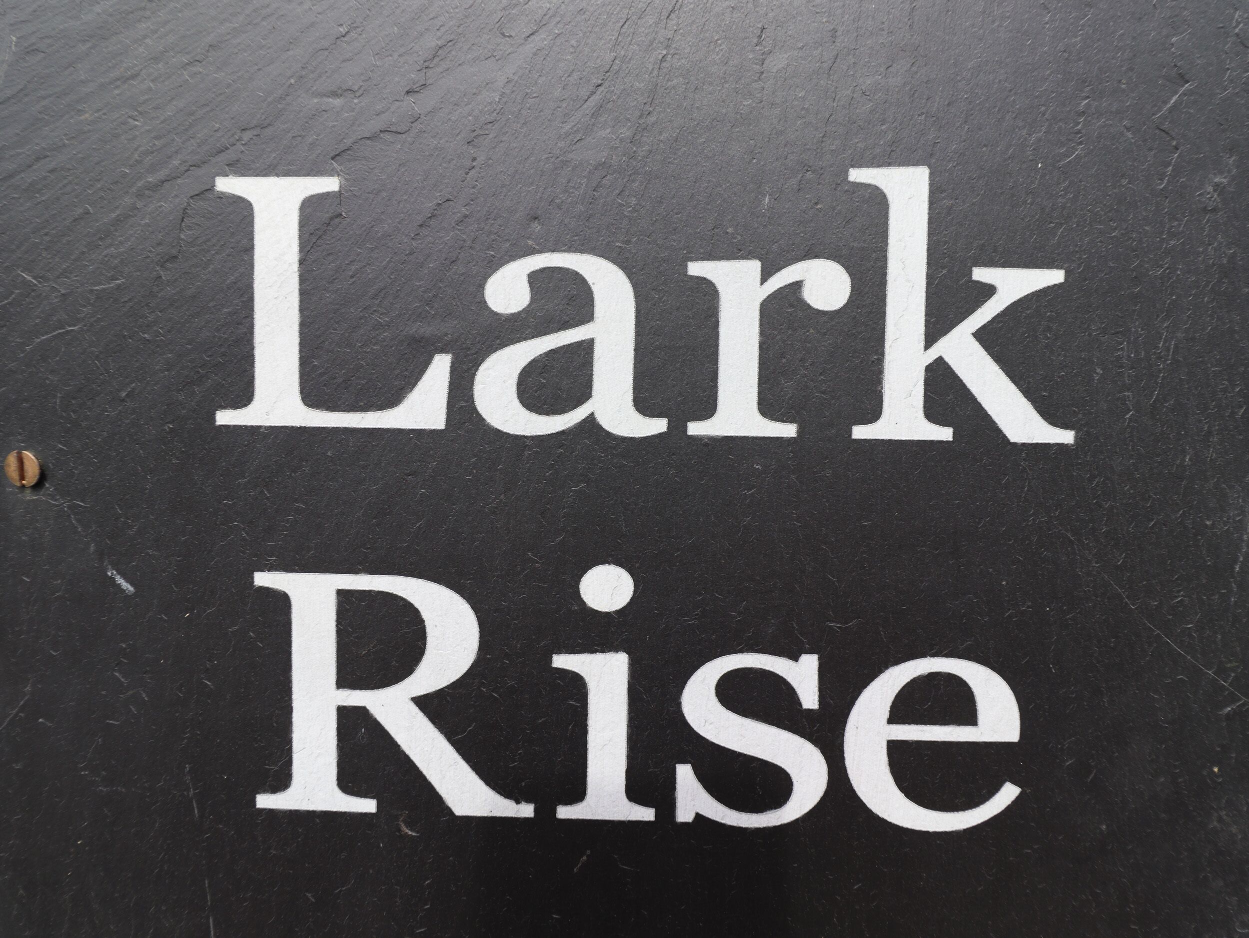 A sign with the text "Lark Rise".