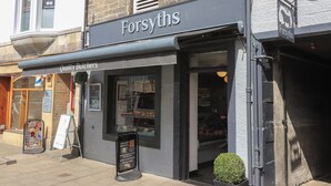 A storefront named 'Forsyths' with a sign indicating 'Quality Butchers'. - 30 Northgate (Peebles)