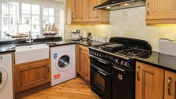 Fridge, electric kettle, toaster, cookware/dishes/utensils