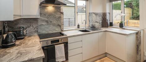Fridge, electric kettle, toaster, cookware/dishes/utensils
