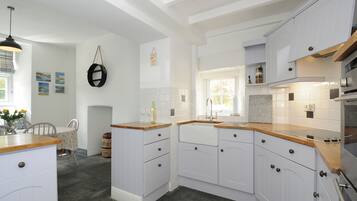 Fridge, electric kettle, cookware/dishes/utensils