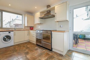 Fridge, dishwasher, electric kettle, cookware/dishes/utensils