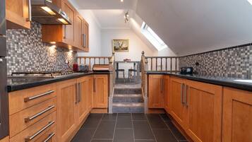 Fridge, dishwasher, electric kettle, cookware/dishes/utensils