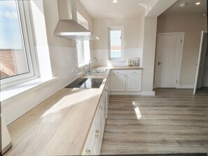 Fridge, dishwasher, cookware/dishes/utensils