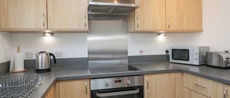 Fridge, electric kettle, toaster, cookware/dishes/utensils