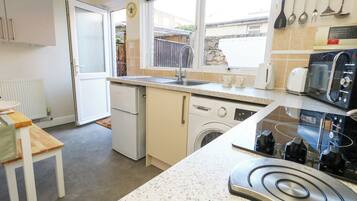 Fridge, electric kettle, toaster, cookware/dishes/utensils