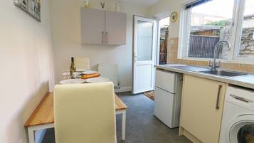 Fridge, electric kettle, toaster, cookware/dishes/utensils