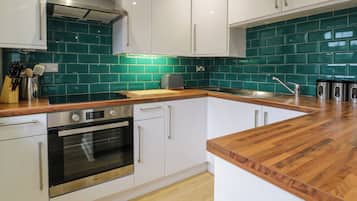Fridge, electric kettle, toaster, cookware/dishes/utensils