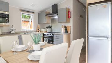 Fridge, electric kettle, toaster, cookware/dishes/utensils