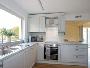 Fridge, dishwasher, electric kettle, cookware/dishes/utensils