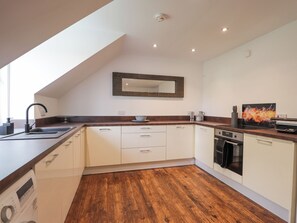 Fridge, electric kettle, toaster, cookware/dishes/utensils