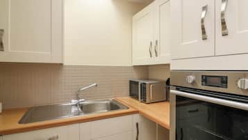 Fridge, electric kettle, toaster, cookware/dishes/utensils