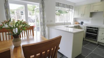 Fridge, dishwasher, electric kettle, cookware/dishes/utensils