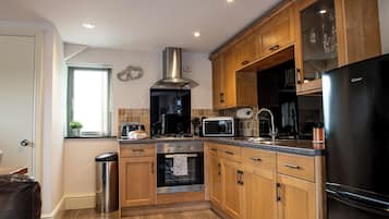 Fridge, electric kettle, toaster, cookware/dishes/utensils
