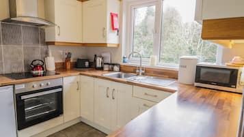 Fridge, electric kettle, toaster, cookware/dishes/utensils