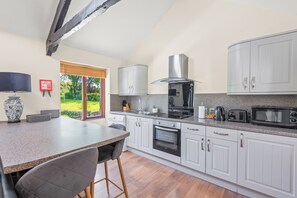 Fridge, electric kettle, toaster, cookware/dishes/utensils