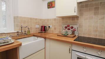 Fridge, electric kettle, cookware/dishes/utensils