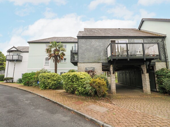 A two-story building with a stone facade, a balcony with white railings, and a sign reading "Tregenna Court." - 5 Tregenna Court (Falmouth)