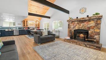 Signature Cabin, 4 Bedrooms, Kitchen, Mountain View | Living room | 50-inch Smart TV with digital channels, fireplace, ping pong