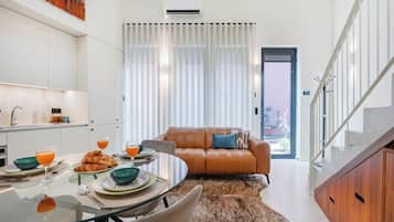 Comfort Duplex, 2 Bedrooms, Non Smoking | Living area | 32-inch flat-screen TV with satellite channels