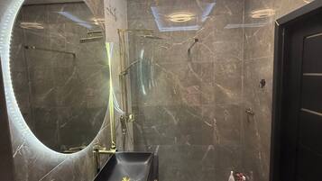 Shower, towels, soap, toilet paper