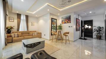 Executive Apartment, 2 Bedrooms, Non Smoking, City View | Living room | 50-inch Smart TV with cable channels, Netflix, streaming services