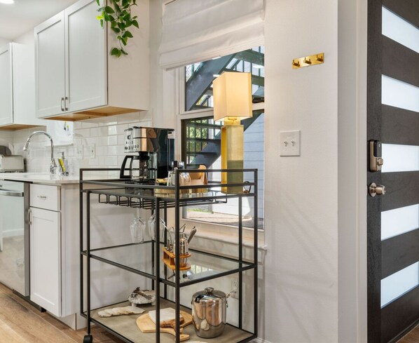 Enjoy a kitchen with coffee machine and a window offering a view of the outside.