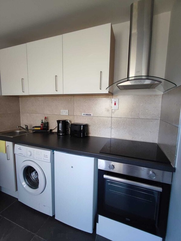 Fridge, oven, electric kettle, toaster