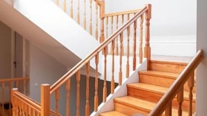 A wooden staircase with a glass ceiling.