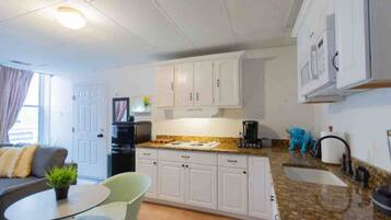 Fridge, microwave, stovetop, coffee/tea maker