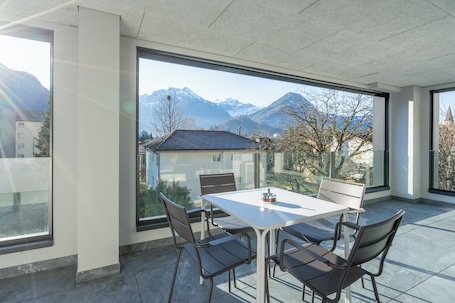 Outdoor dining. Swiss Hotel Apartments Interlaken Two Bedrooms King and twin